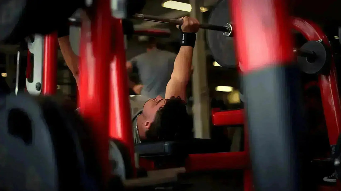 CrossFit athlete using Rip Toned stiff wrist wraps for overhead press