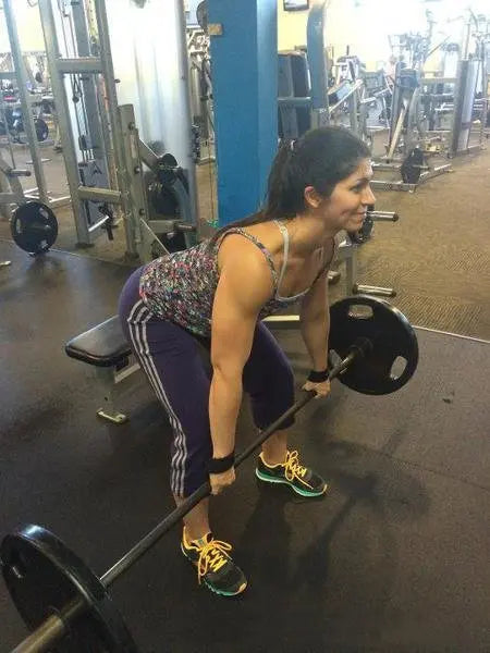 Black Rip Toned lifting straps during row exercise