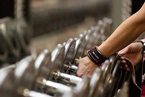 Gray Rip Toned lifting straps rolled beside chalk bowl