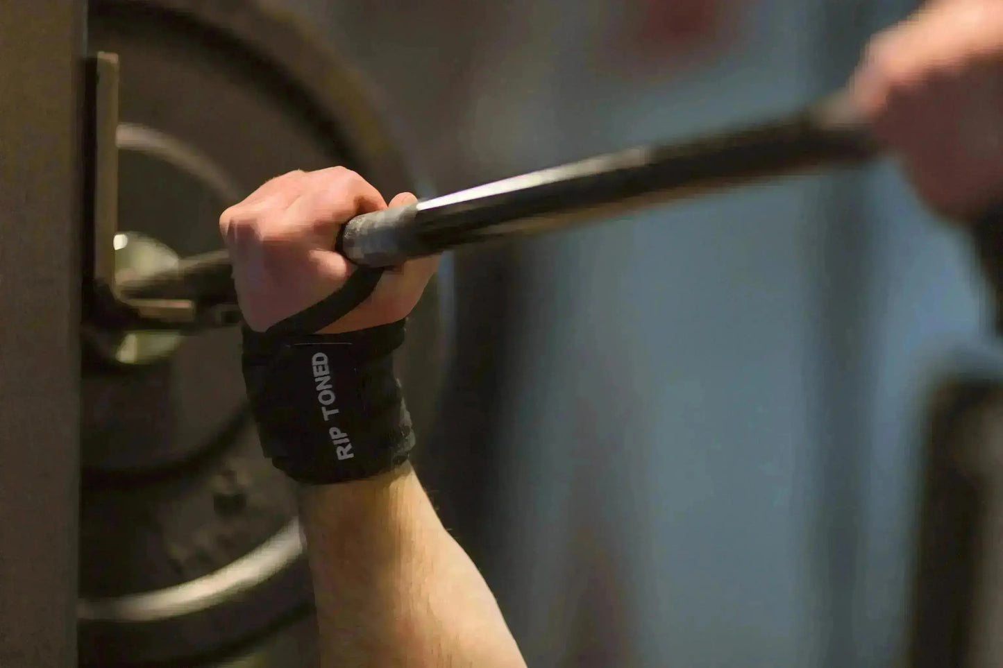 Rip Toned stiff wrist wraps in green camo worn during workout