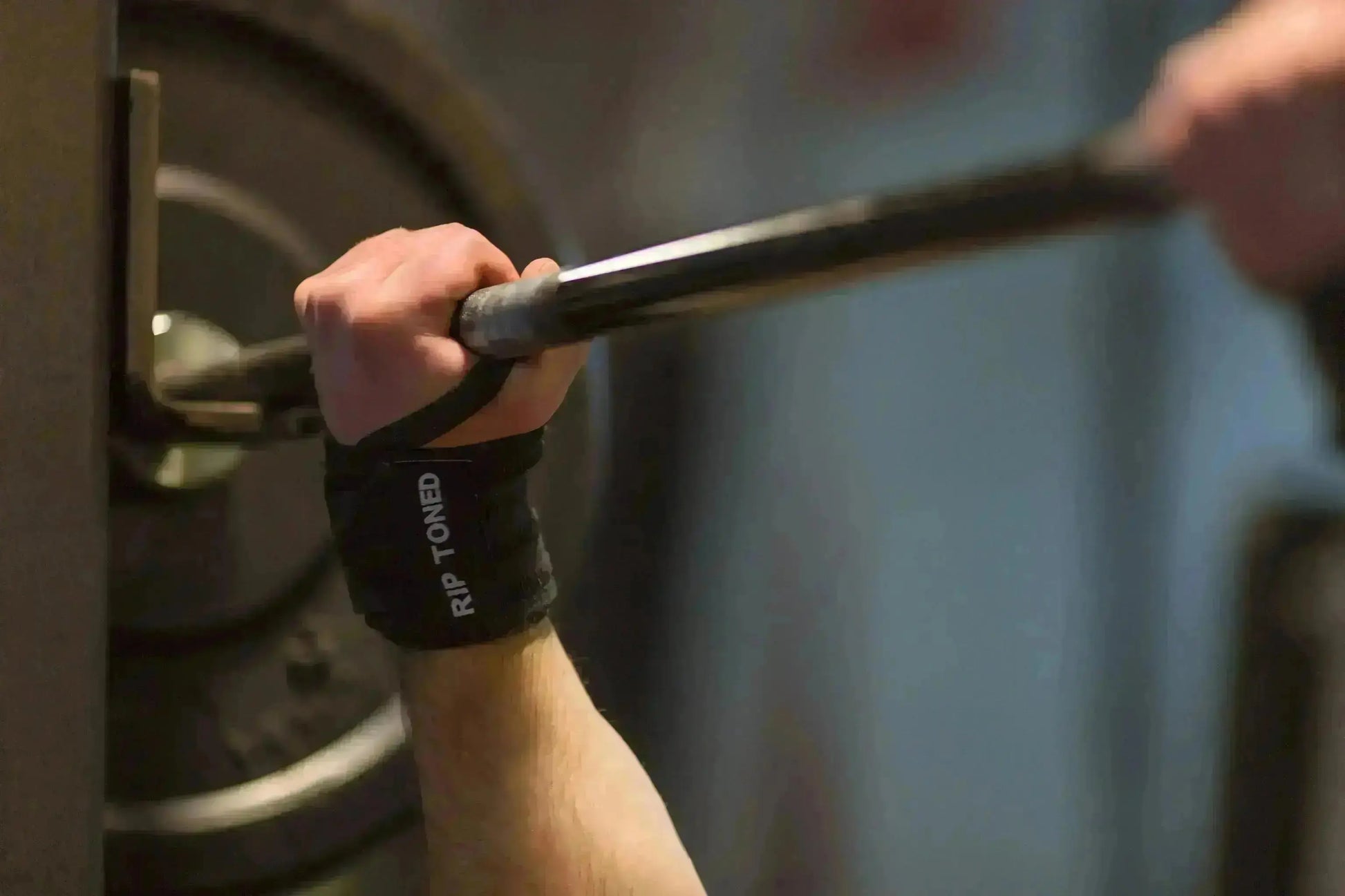 Rip Toned stiff wrist wraps in green camo worn during workout