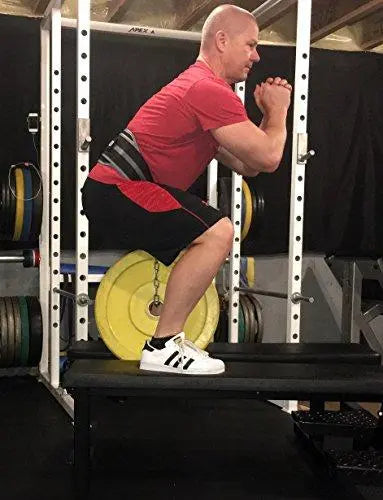 Rip Toned dip belt worn during bar dips in gym