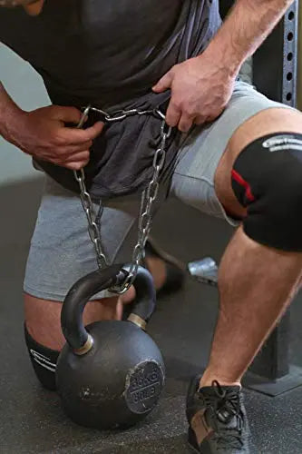 Rip Toned dip belt worn during bar dips in gym