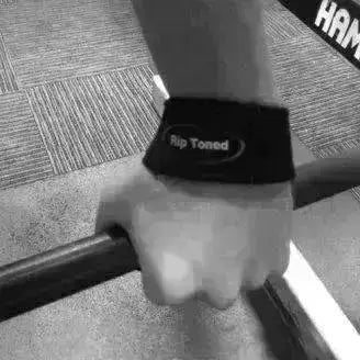 Black Rip Toned wrist wraps and lifting straps mid-deadlift