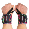 Two hands wearing Rip Toned Wrist Wraps: Stiff and Flex in Small Flower, with black elastic straps and visible Rip Toned logos, provide powerlifter-level wrist support against a white background.